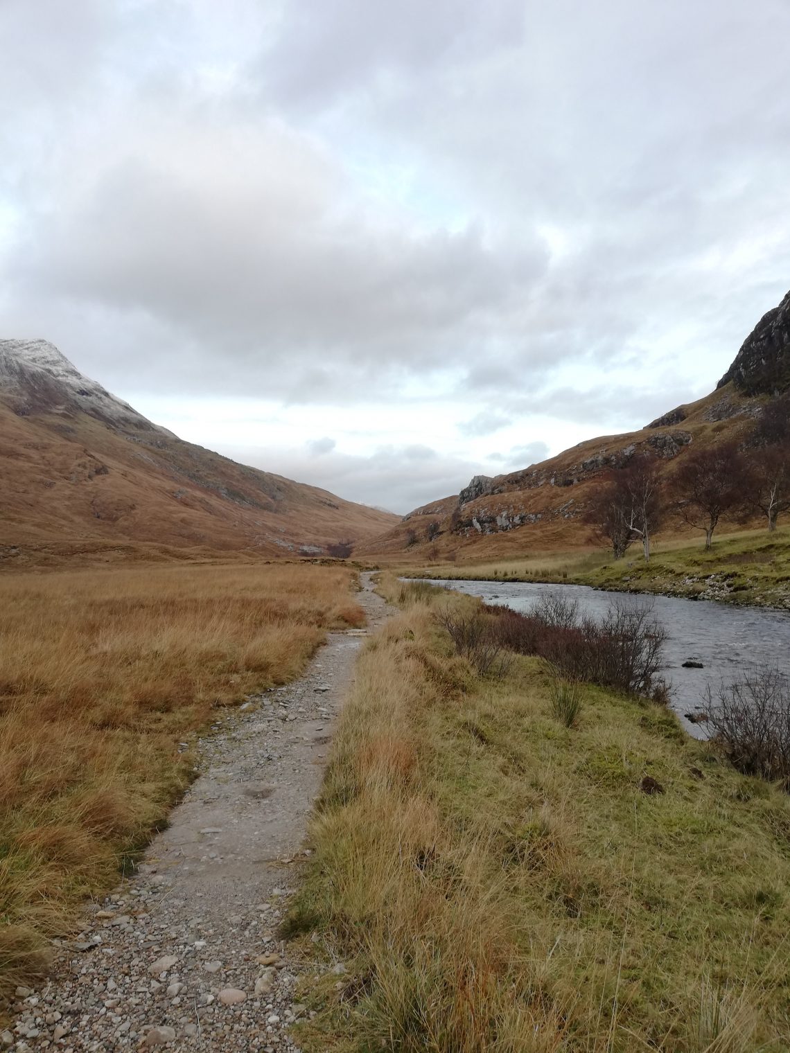 Navigation practice in Glen Nevis with the footpath running along the river down the glen framed by hillsides on both sides.